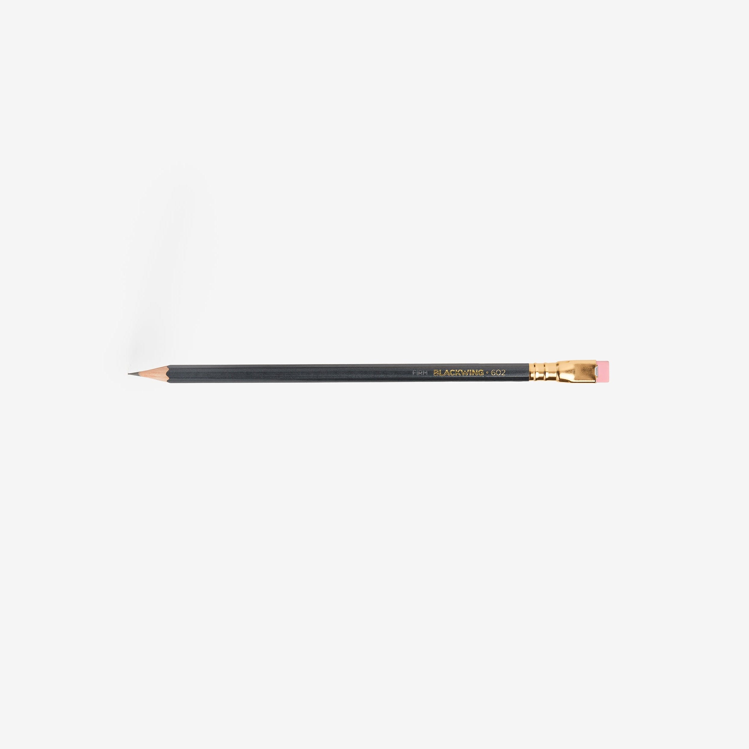 Pencil with gold accents on a white background
