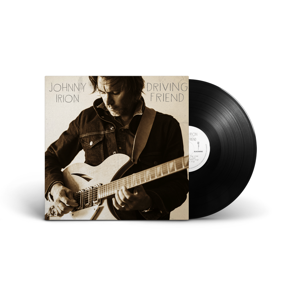 Vinyl record with a cover featuring a person playing guitar, on a white background