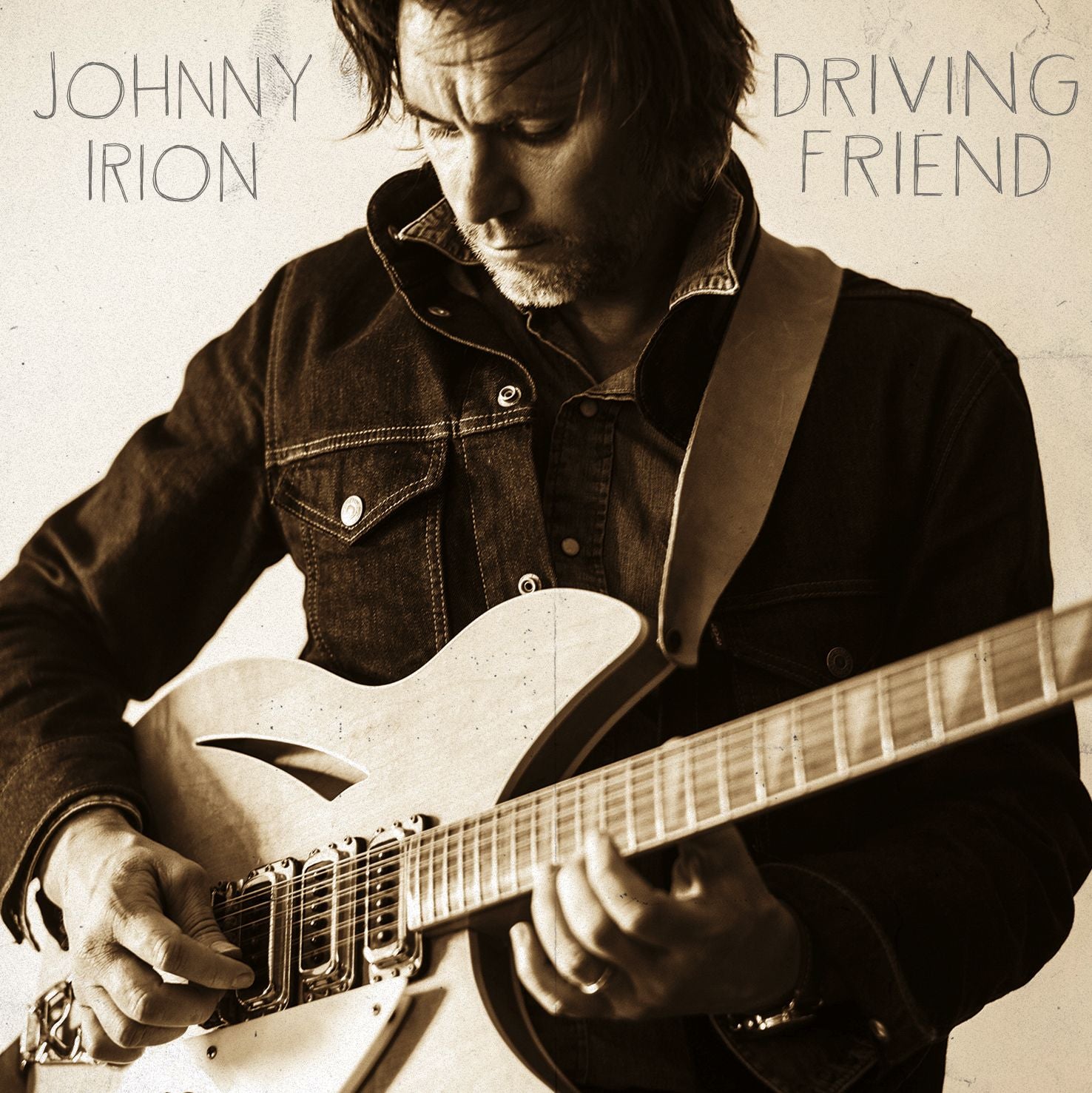 Album cover with a person playing guitar, featuring the text 'Johnny Irion' and 'Driving Friend'.