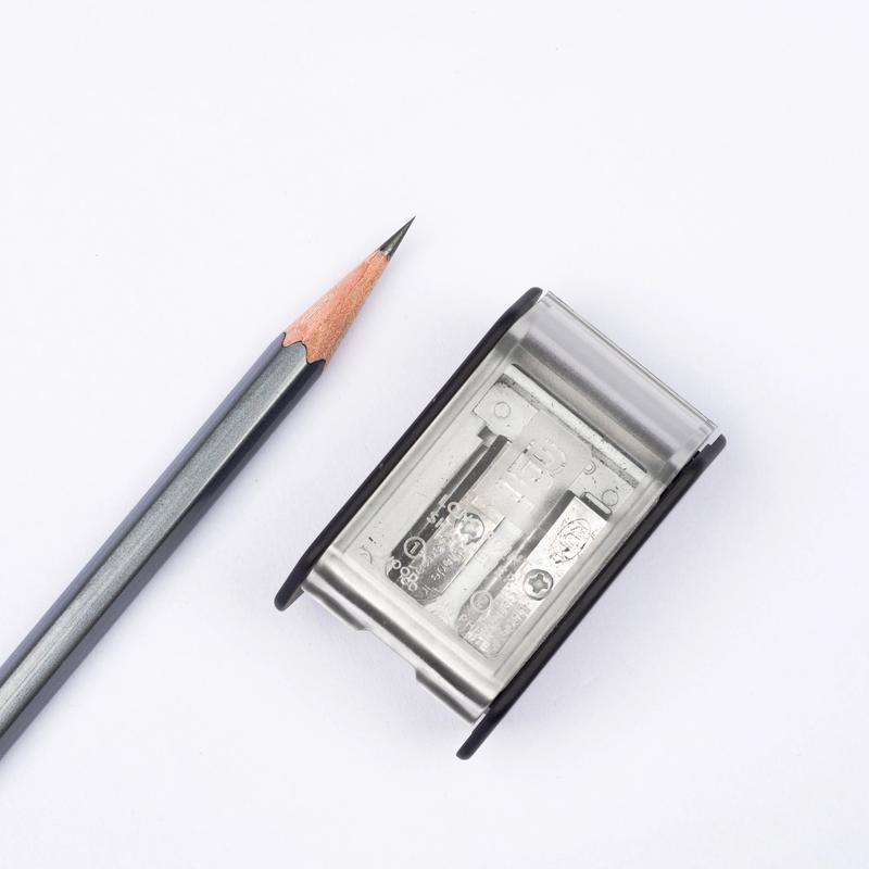 Pencil sharpener with a pencil on a white background